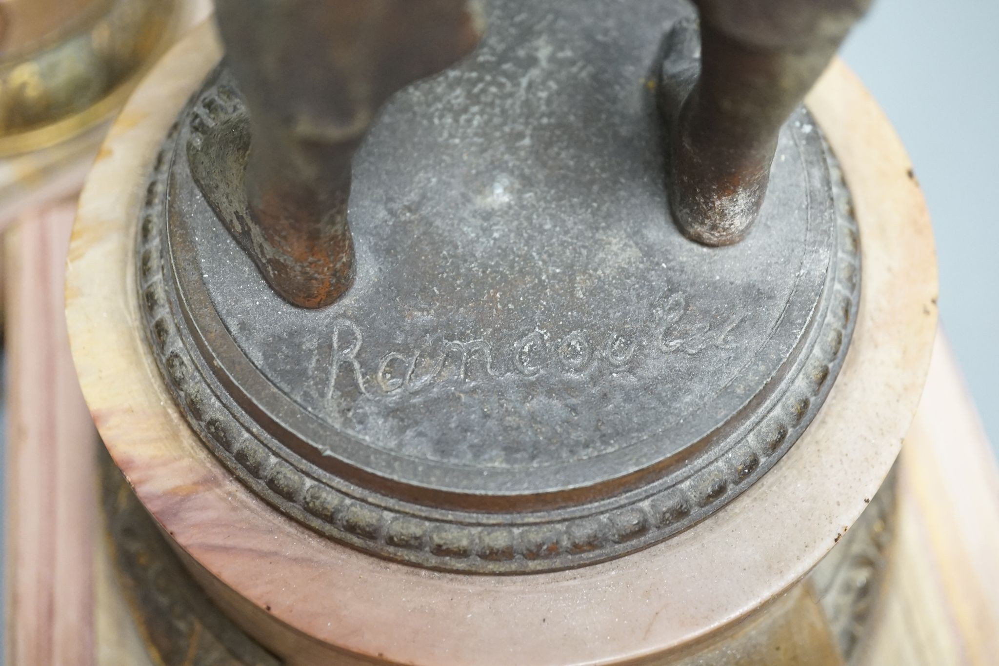 A spelter and marble figural mantel clock and a matching vase 47cm